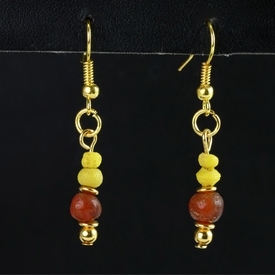 Earrings with yellow Roman glass and carnelian beads