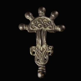 Migration Period, Merovingian silver radiate-headed brooch with bird-heads