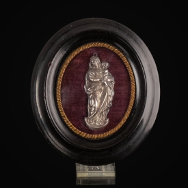 Antique silver devotional plaque of the Madonna and Child in wooden frame