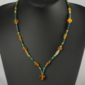 Necklace with Roman green and amber coloured glass beads