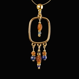 Pendant with Roman blue and amber coloured glass beads