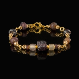 Bracelet with Roman purple and semi-translucent glass beads in a linked design