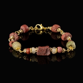 Bracelet with Roman red and semi-translucent glass beads in a linked design