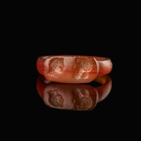 Ancient Egyptian carnelian seal ring with facing busts