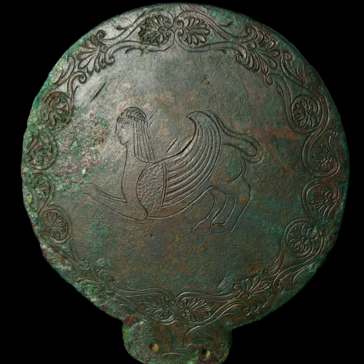 Ancient Etruscan bronze hand mirror, engraved with Sphinx