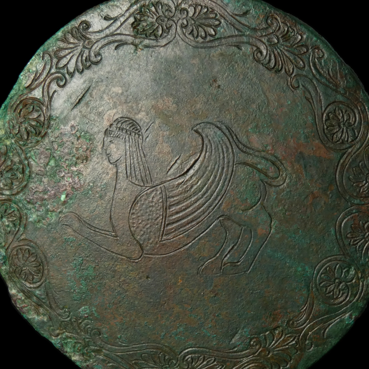 Ancient Etruscan bronze hand mirror, engraved with Sphinx