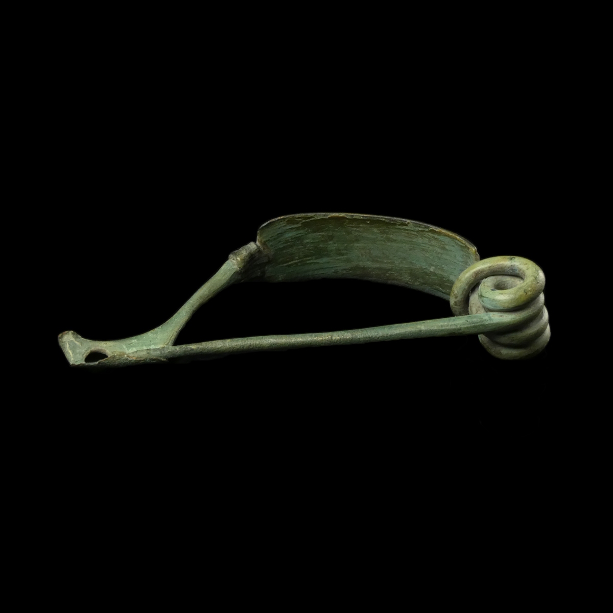 Ancient Roman bronze decorated bow fibula with wolf's head foot