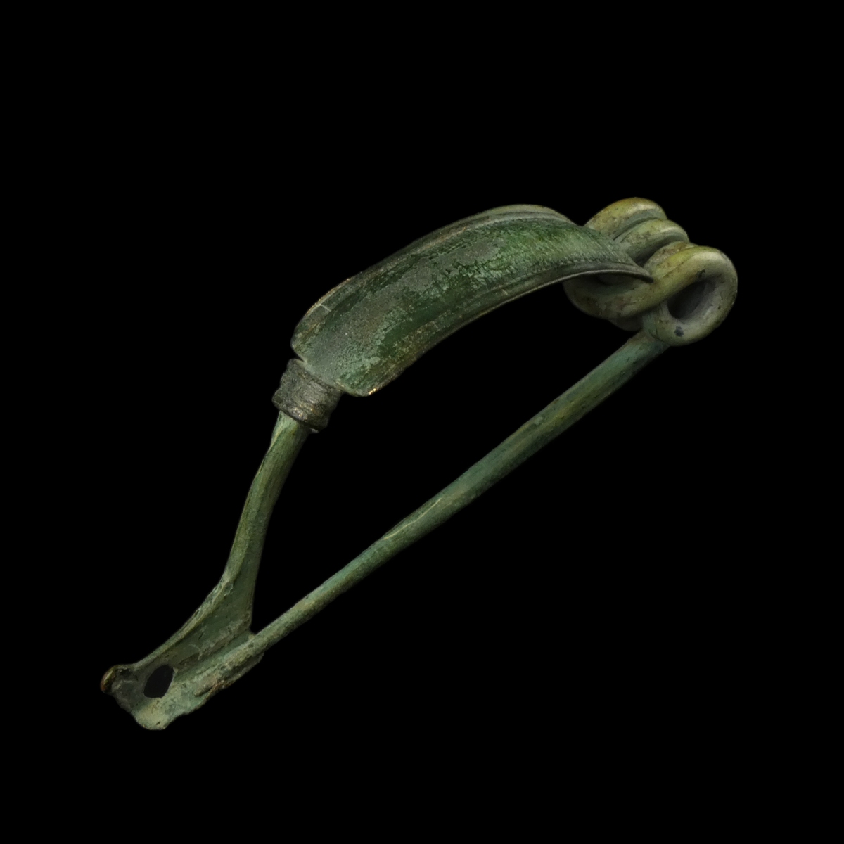 Ancient Roman bronze decorated bow fibula with wolf's head foot