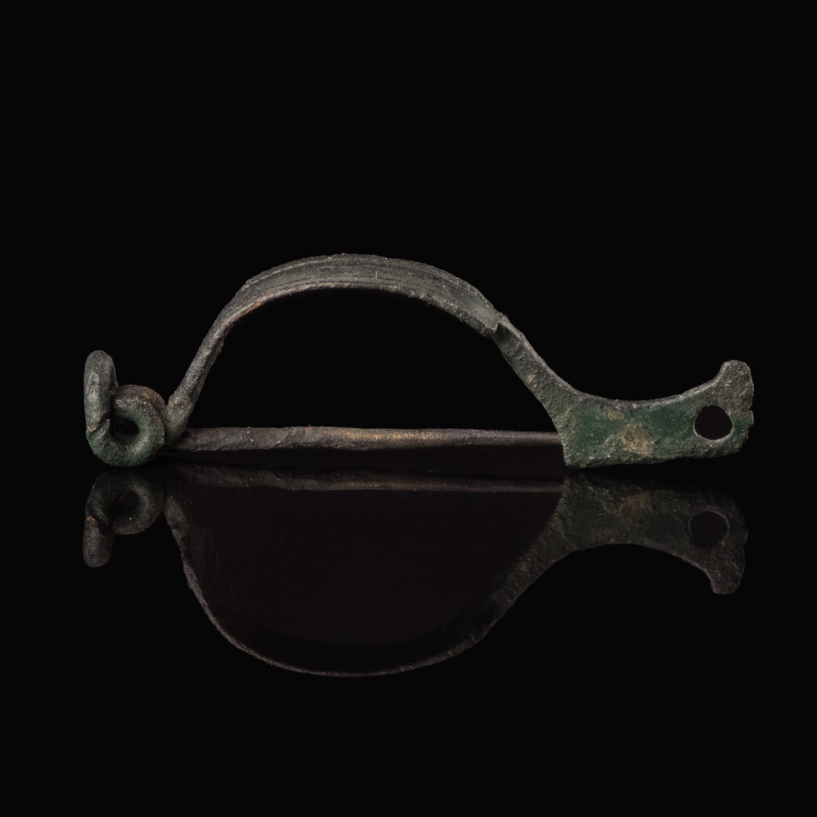 Ancient Roman bronze decorated bow fibula with wolf's head foot
