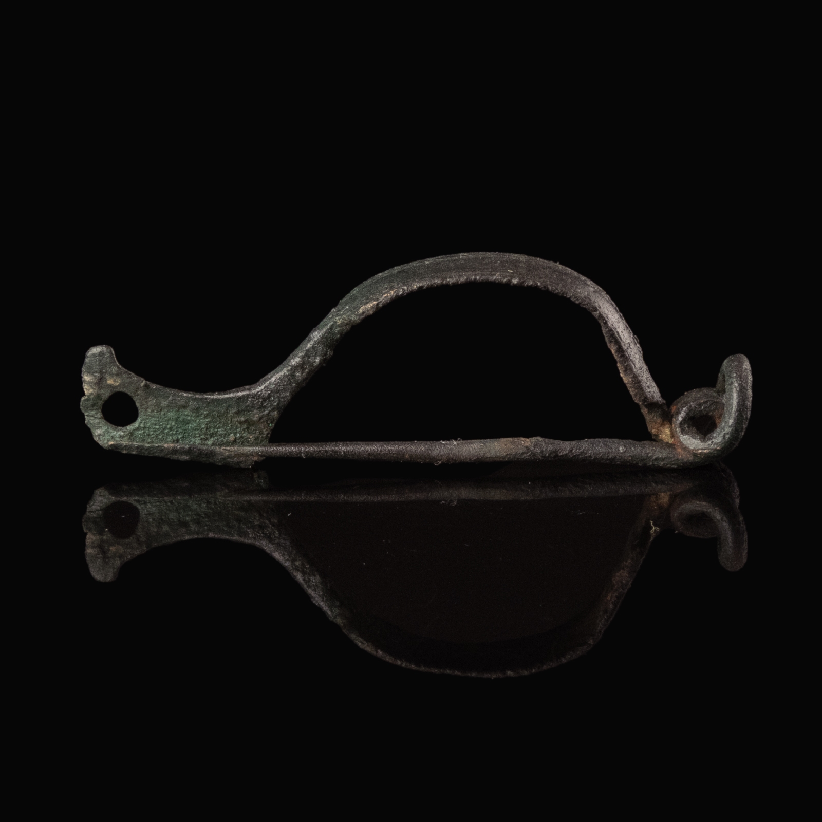 Ancient Roman bronze decorated bow fibula with wolf's head foot