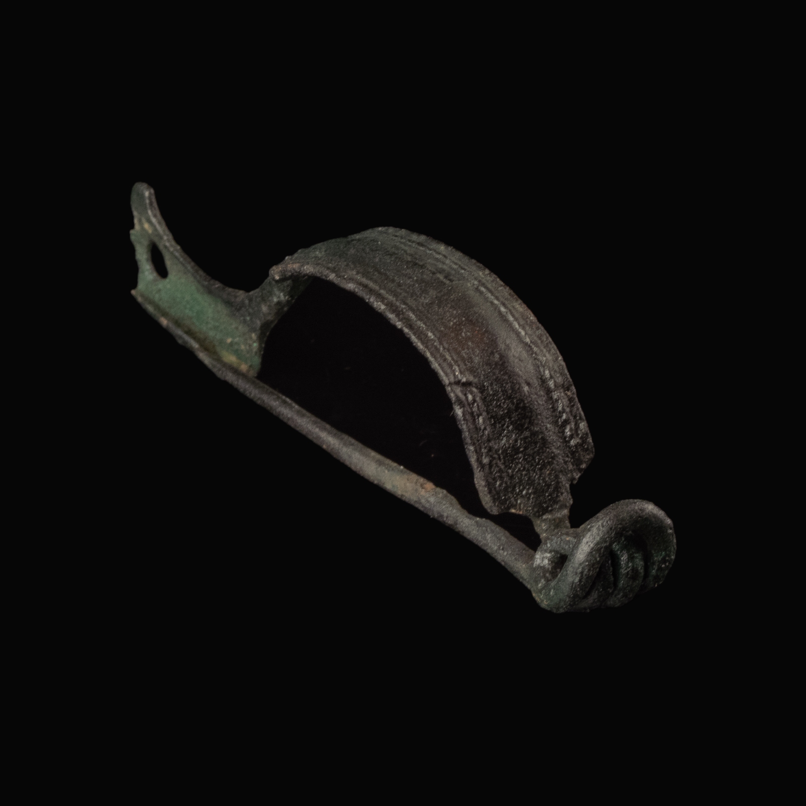 Ancient Roman bronze decorated bow fibula with wolf's head foot