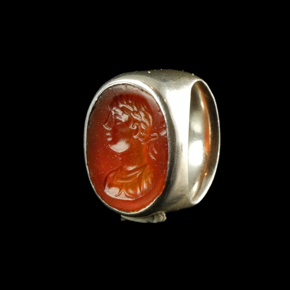 Ancient Roman carnelian intaglio with bust of Apollo, set in silver ring