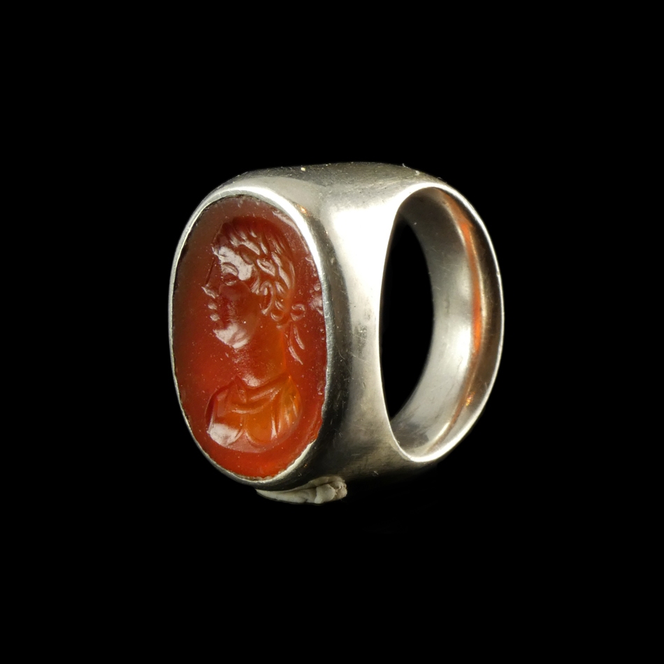 Ancient Roman carnelian intaglio with bust of Apollo, set in silver ring