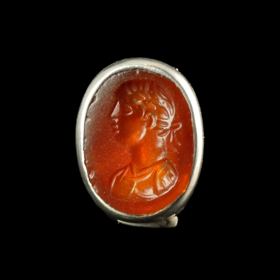 Ancient Roman carnelian intaglio with bust of Apollo, set in silver ring