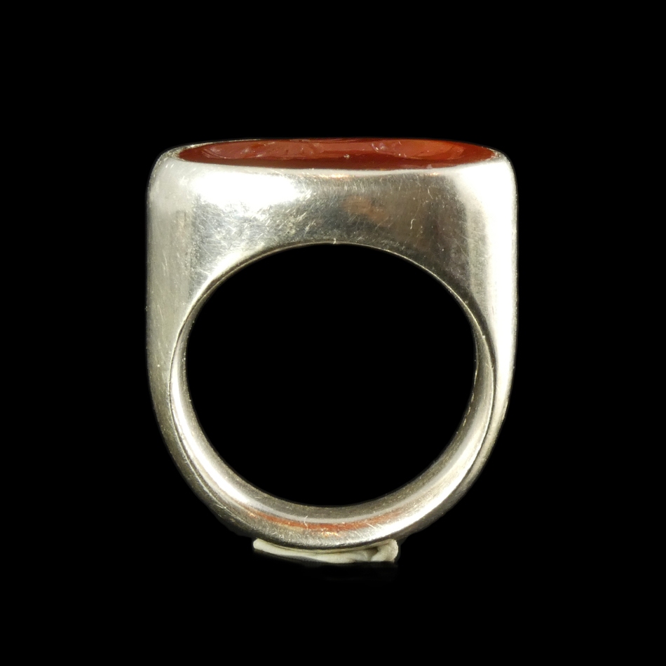 Ancient Roman carnelian intaglio with bust of Apollo, set in silver ring