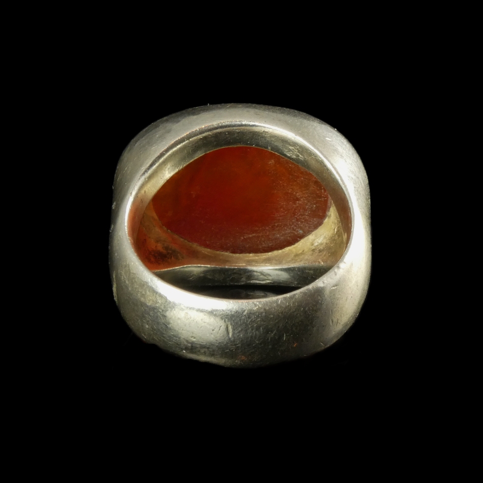 Ancient Roman carnelian intaglio with bust of Apollo, set in silver ring