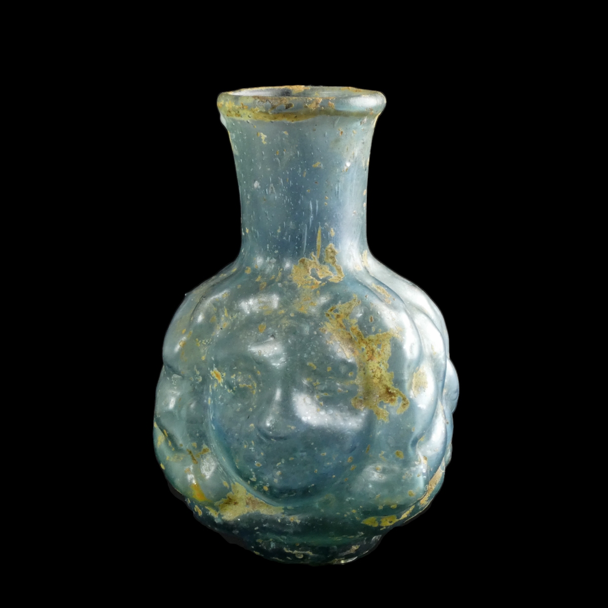 Ancient Roman Janus head glass bottle