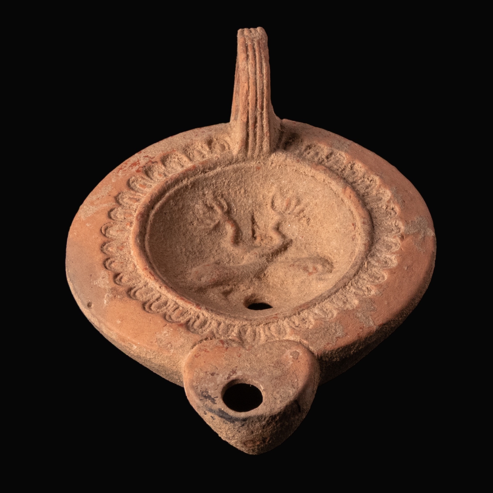 Ancient Roman Terracotta Oil Lamp with Dolphins