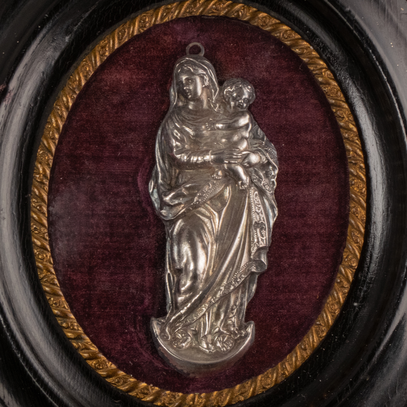 Antique silver devotional plaque of the Madonna and Child in wooden frame