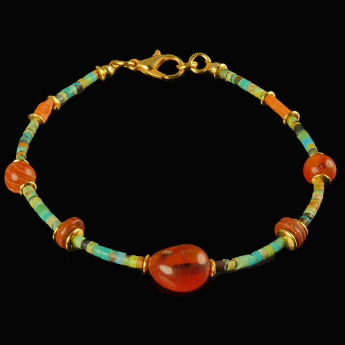 Bracelet with Egyptian faience, carnelian and coral beads