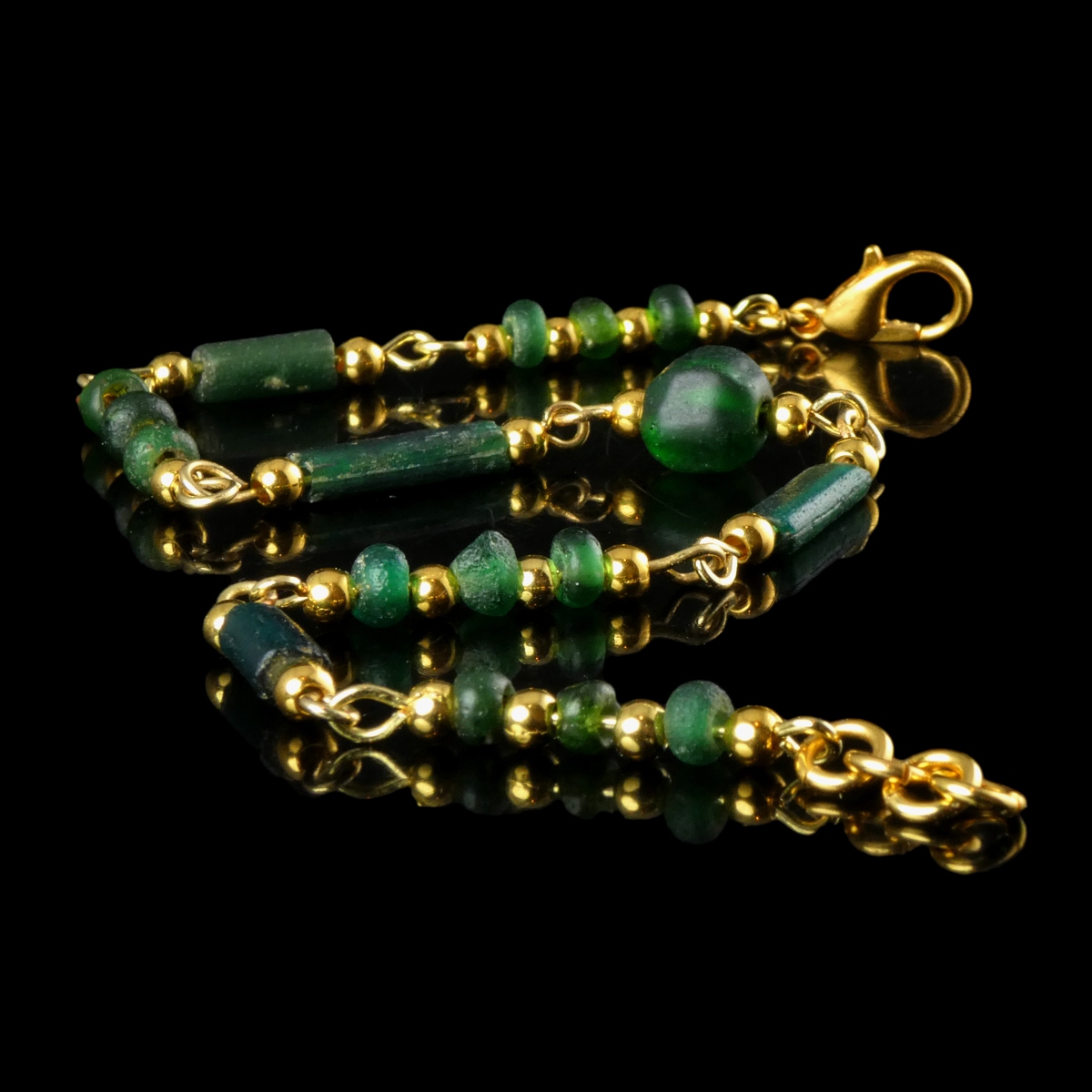 Bracelet with Roman green glass beads in a linked design