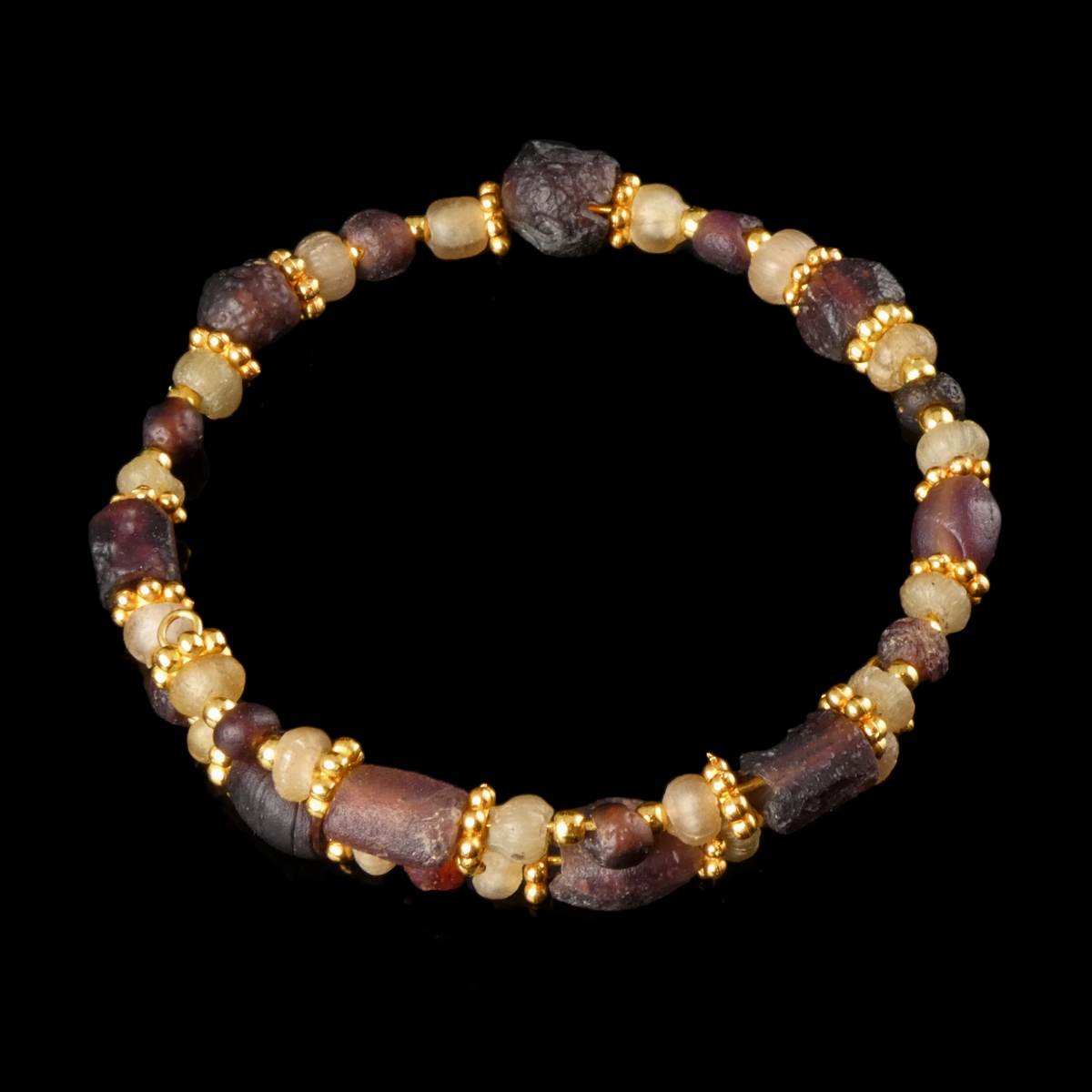 Bracelet with Roman purple and semi-translucent glass beads in a flexible design