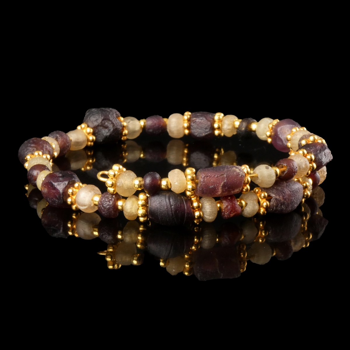 Bracelet with Roman purple and semi-translucent glass beads in a flexible design