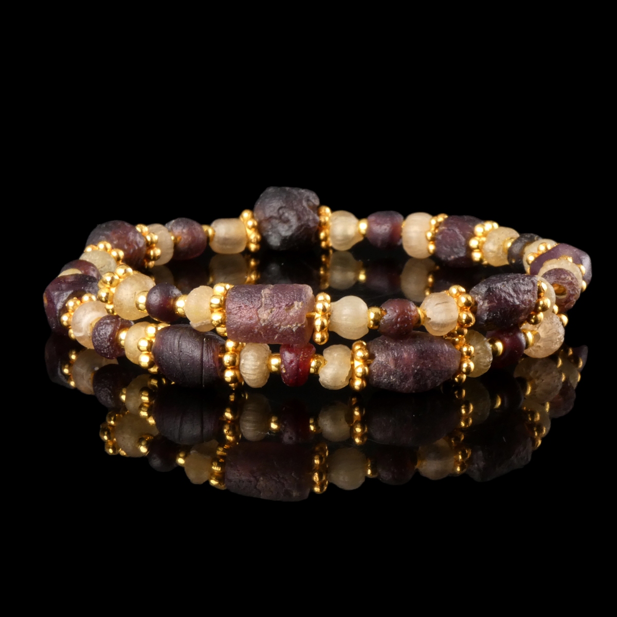 Bracelet with Roman purple and semi-translucent glass beads in a flexible design