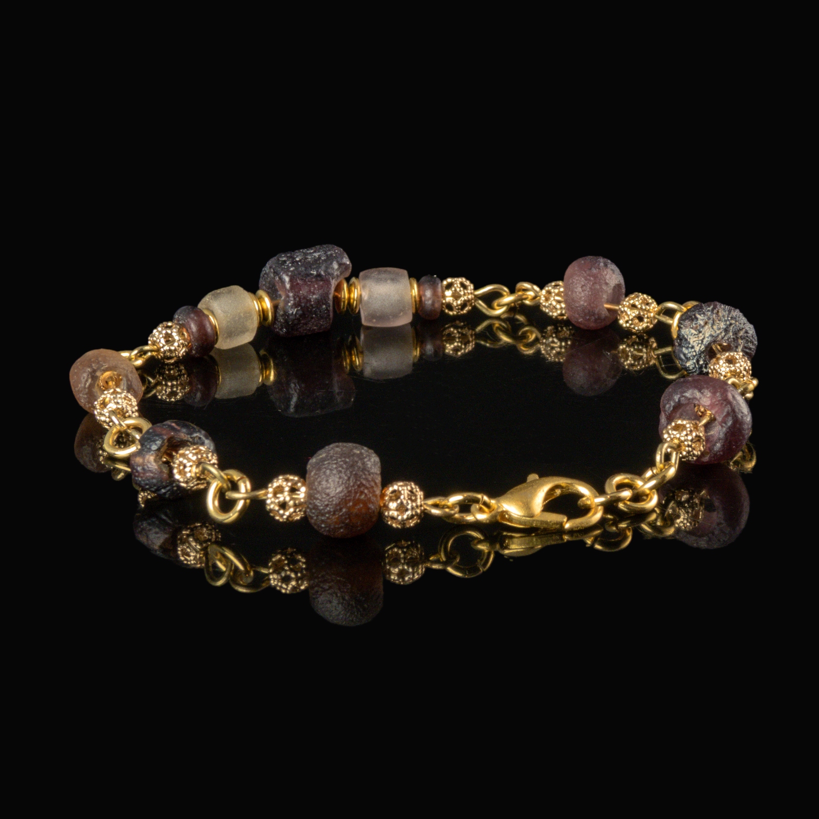 Bracelet with Roman purple and semi-translucent glass beads in a linked design