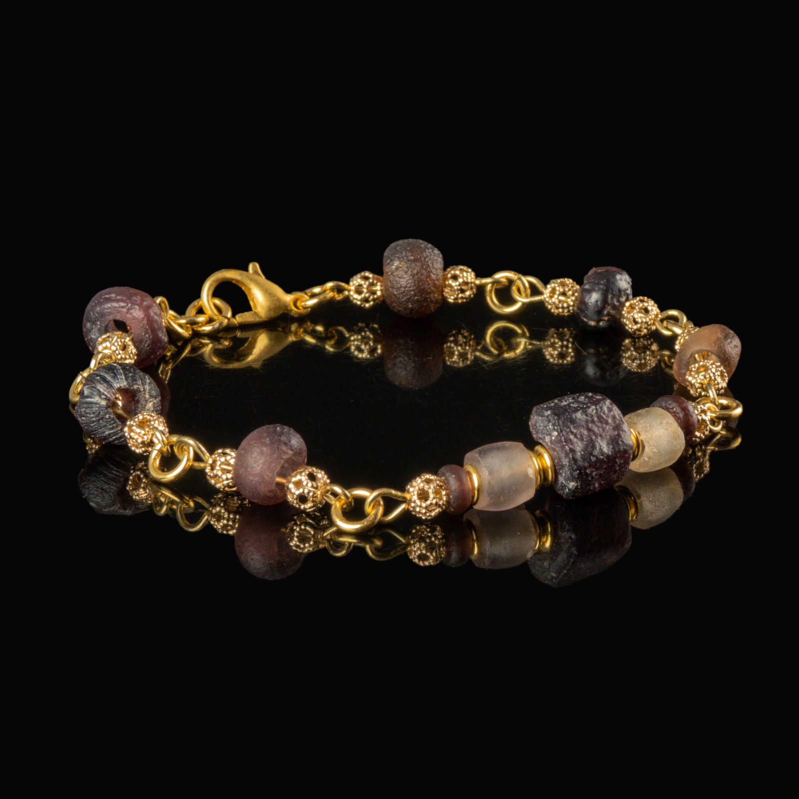 Bracelet with Roman purple and semi-translucent glass beads in a linked design