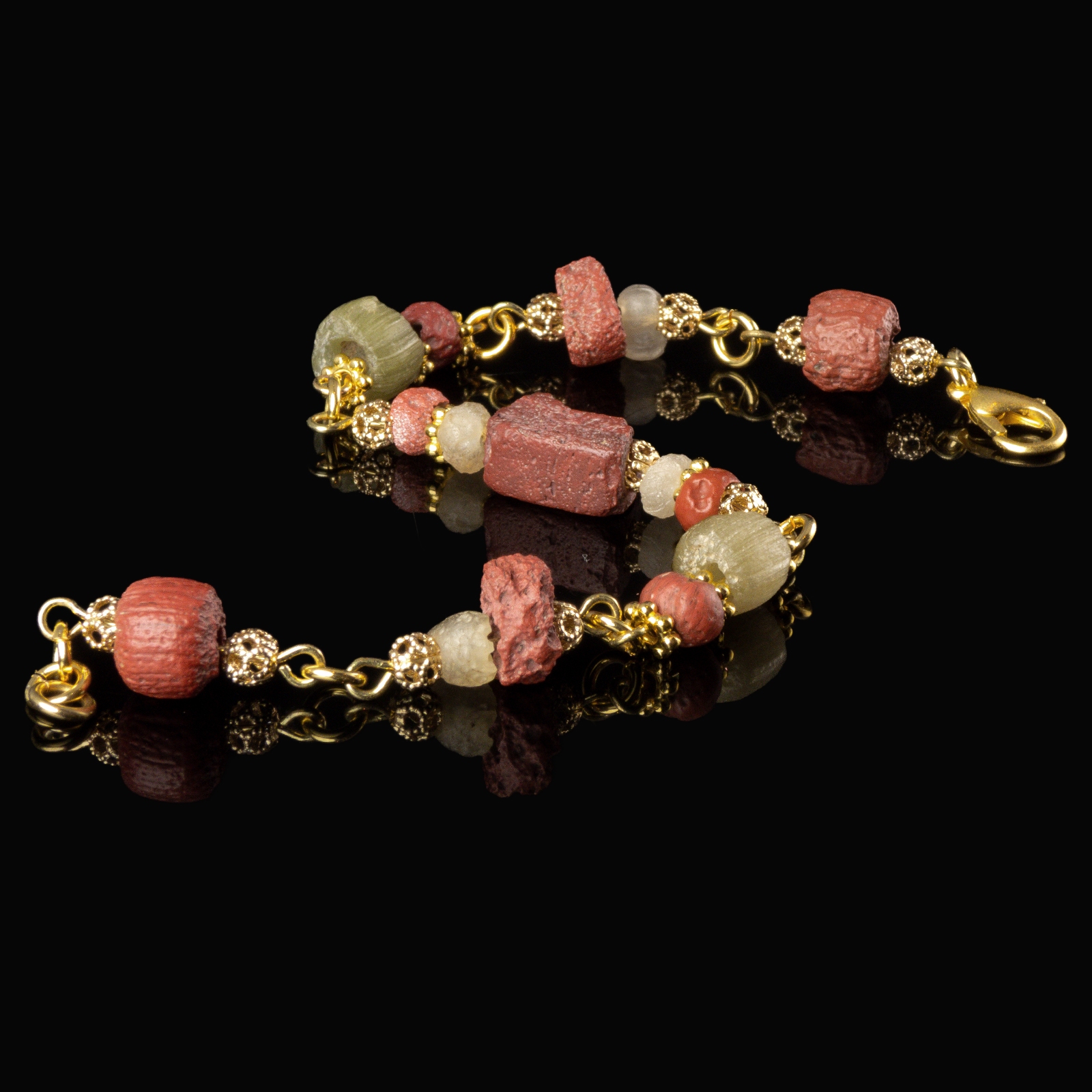 Bracelet with Roman red and semi-translucent glass beads in a linked design