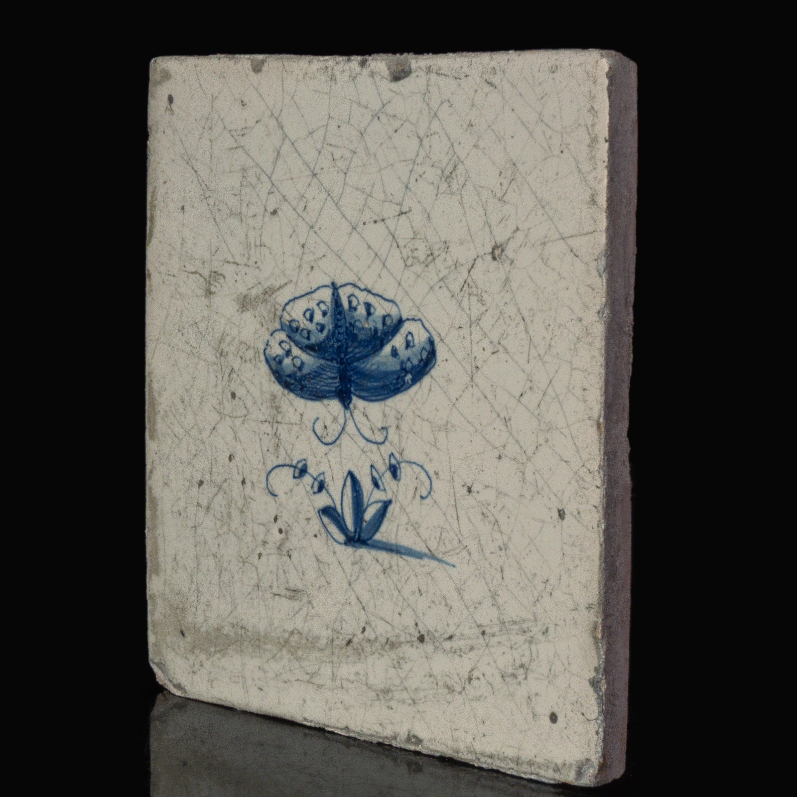 Dutch Delft blue and white tile with a butterfly
