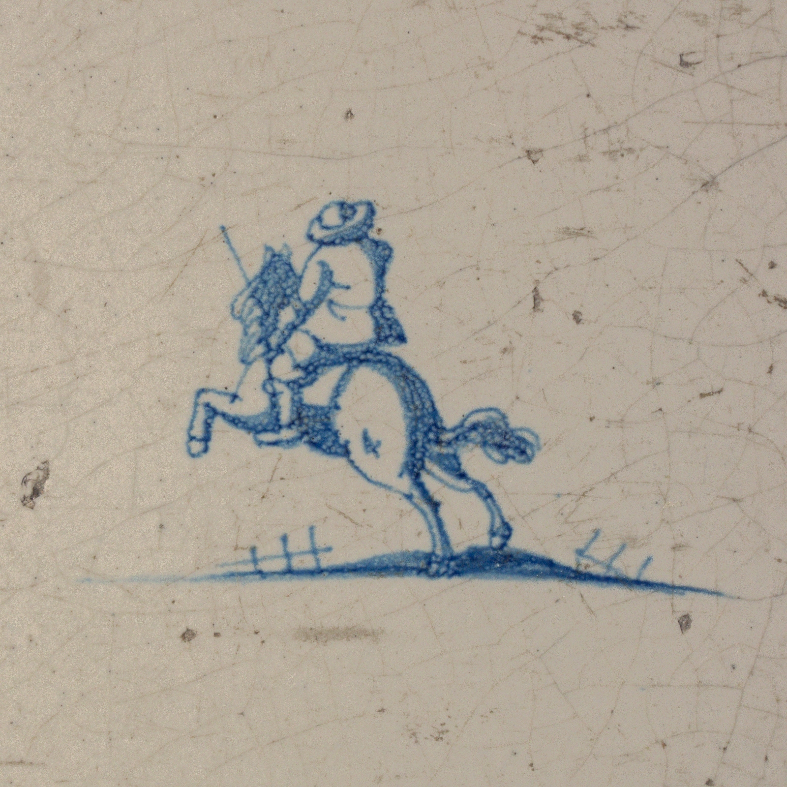 Dutch Delft blue and white tile with a Rider on horseback