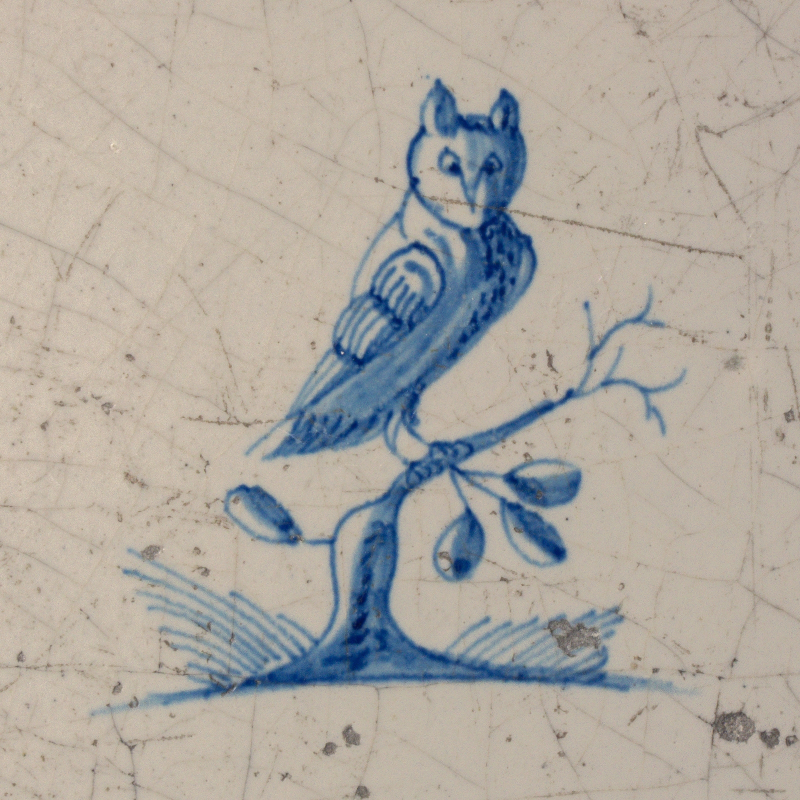 Dutch Delft blue and white tile with an Owl on a branch
