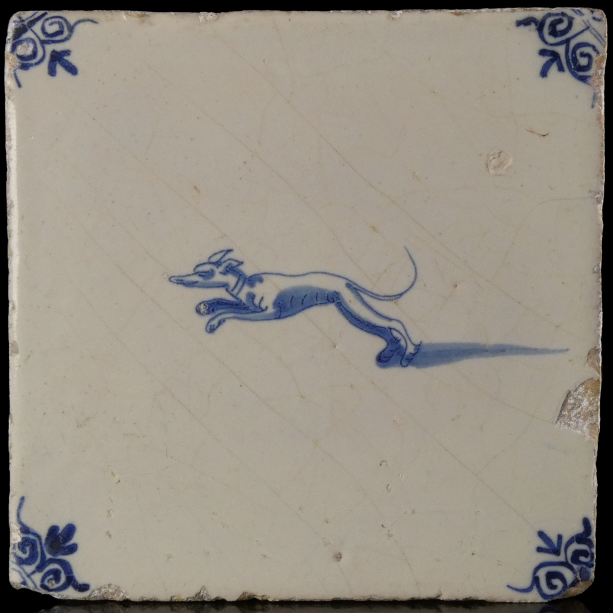 Dutch Delft blue and white tile with hunting dog