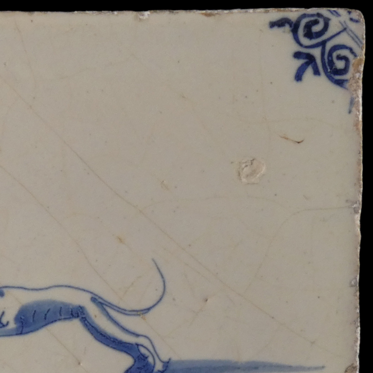 Dutch Delft blue and white tile with hunting dog