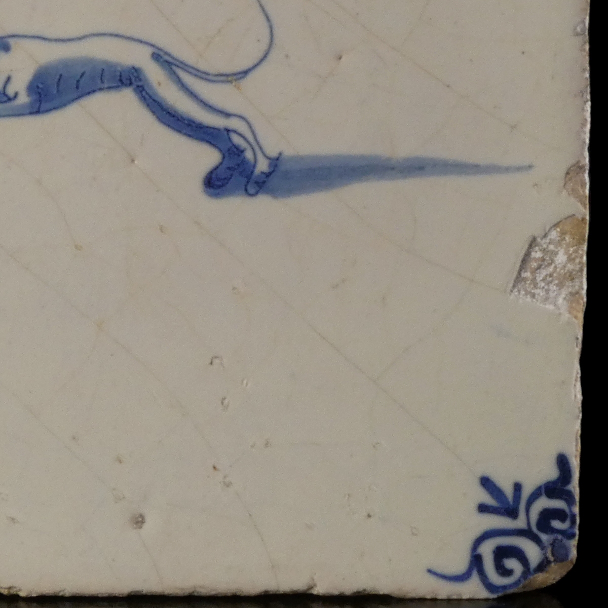Dutch Delft blue and white tile with hunting dog