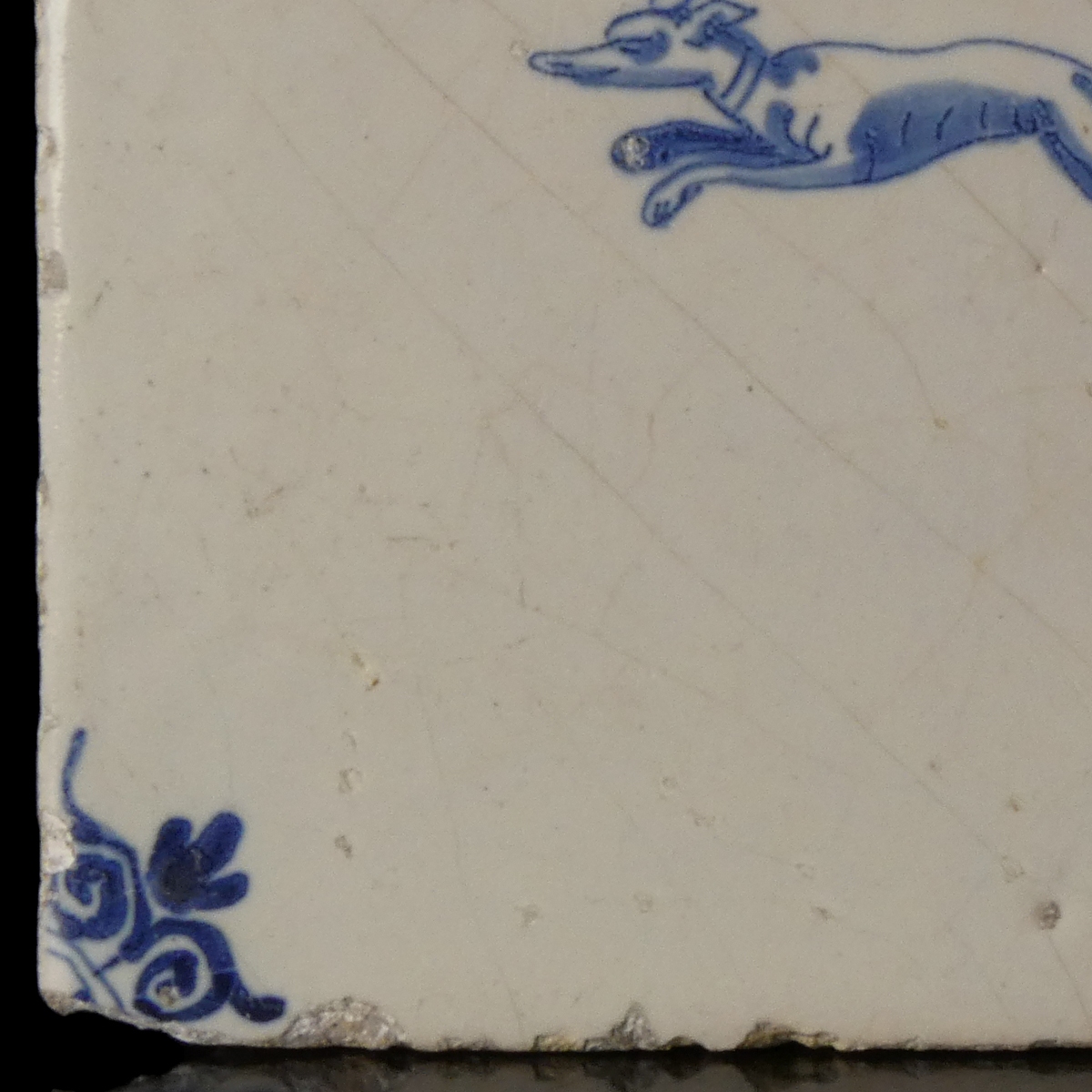 Dutch Delft blue and white tile with hunting dog