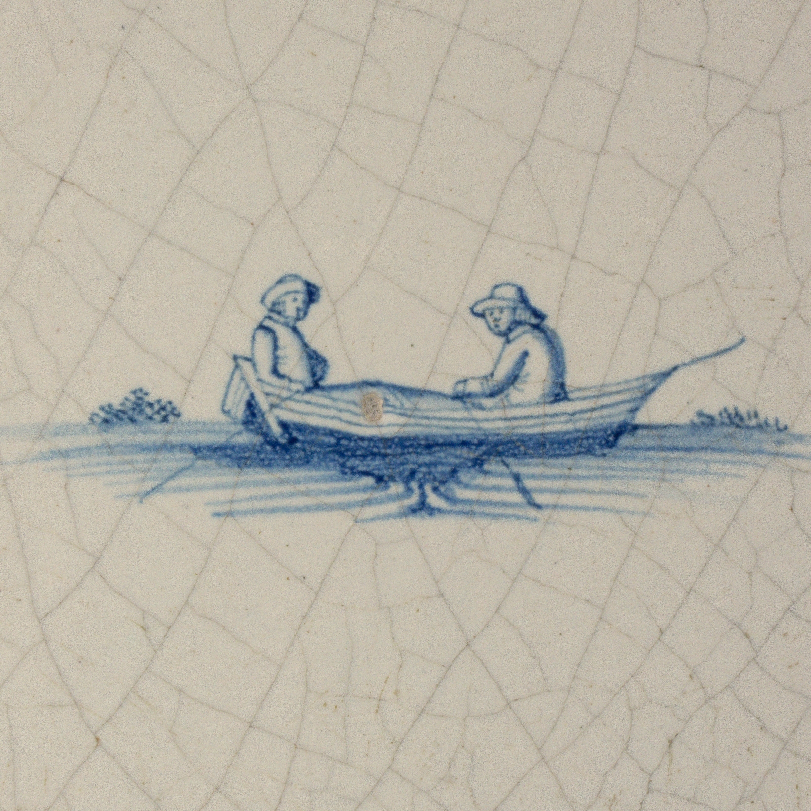 Dutch Delft blue and white tile with two people in a rowing boat