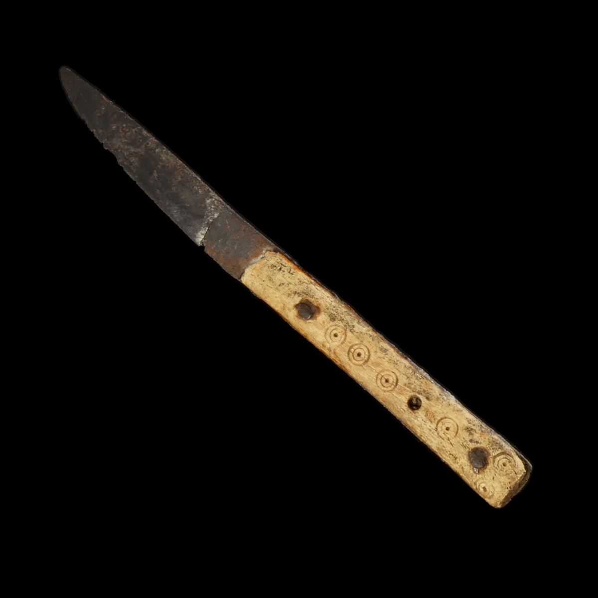 Early Medieval iron knife with decorated bone handle