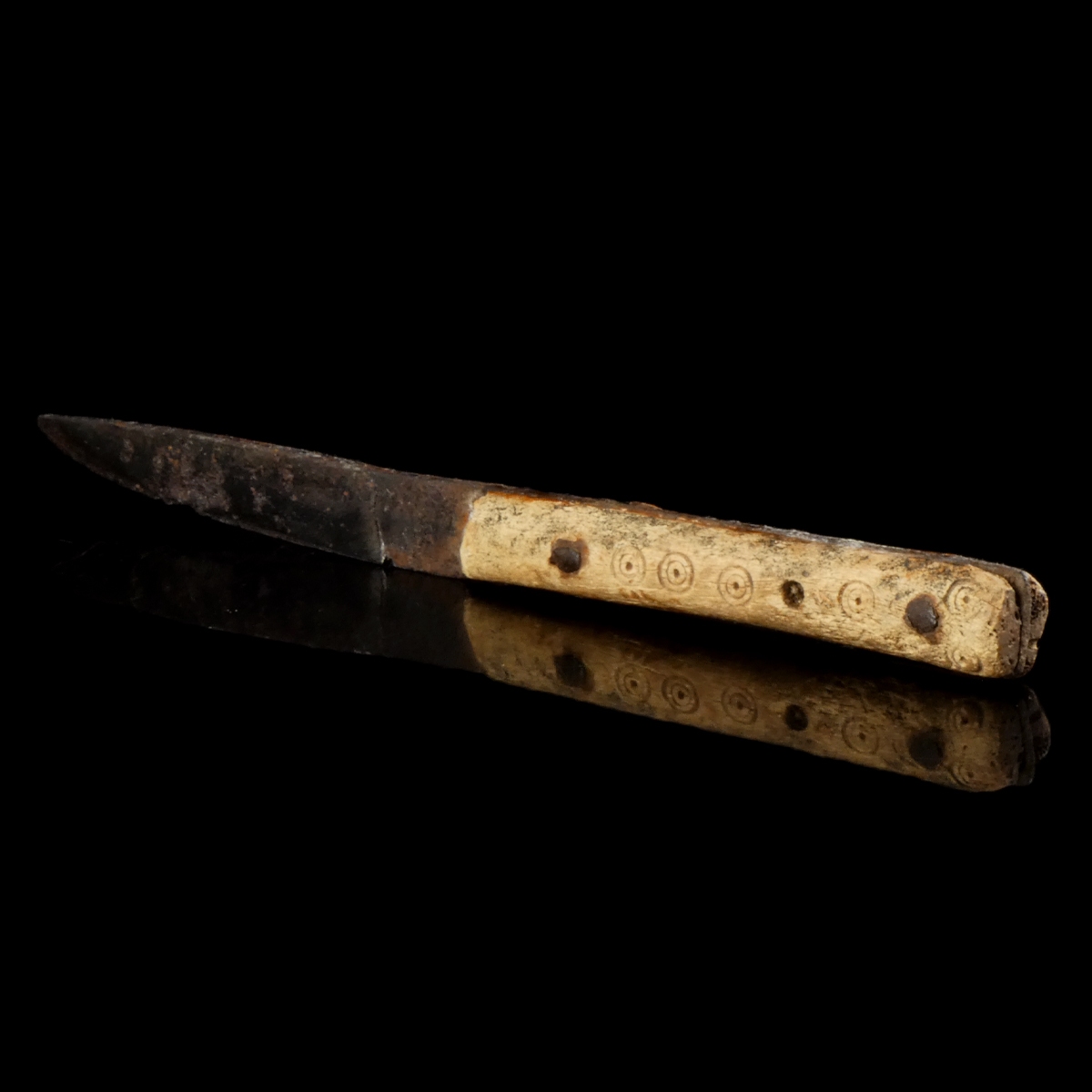 Early Medieval iron knife with decorated bone handle