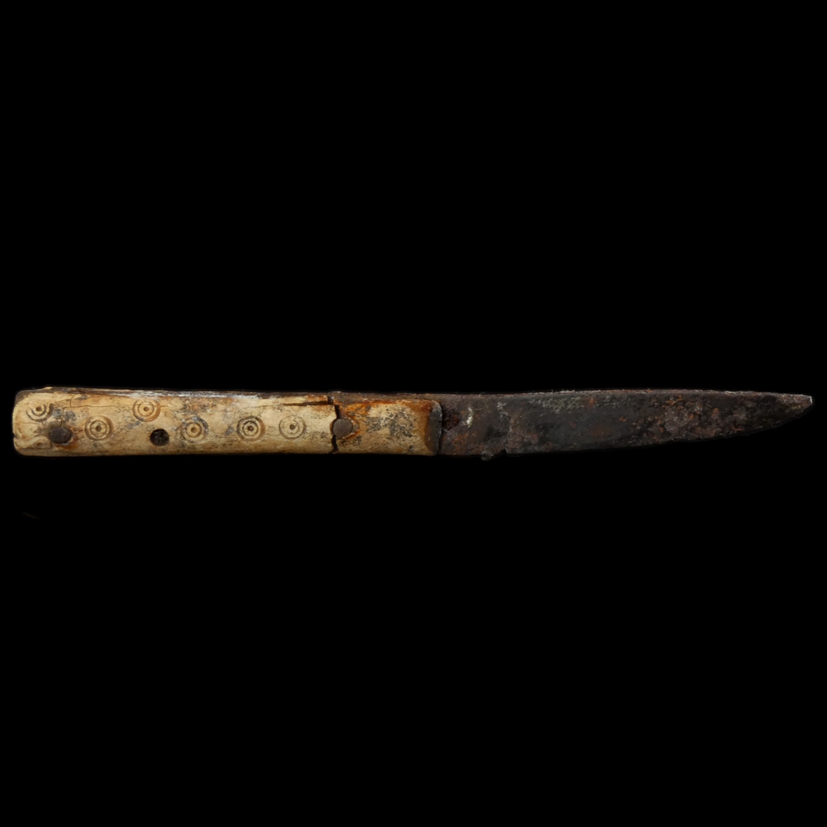 Early Medieval iron knife with decorated bone handle