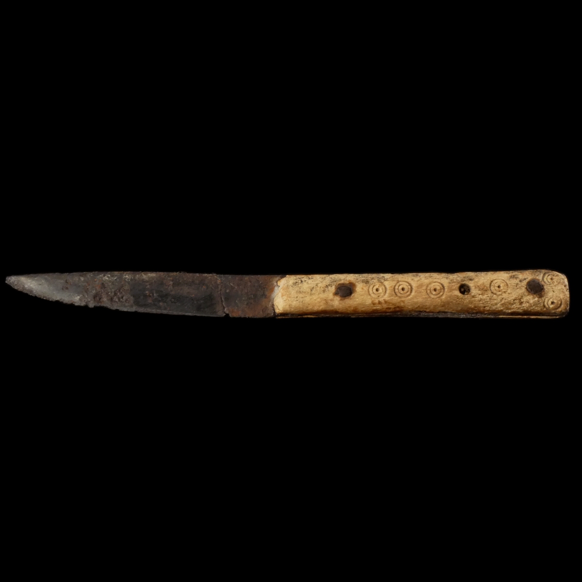 Early Medieval iron knife with decorated bone handle
