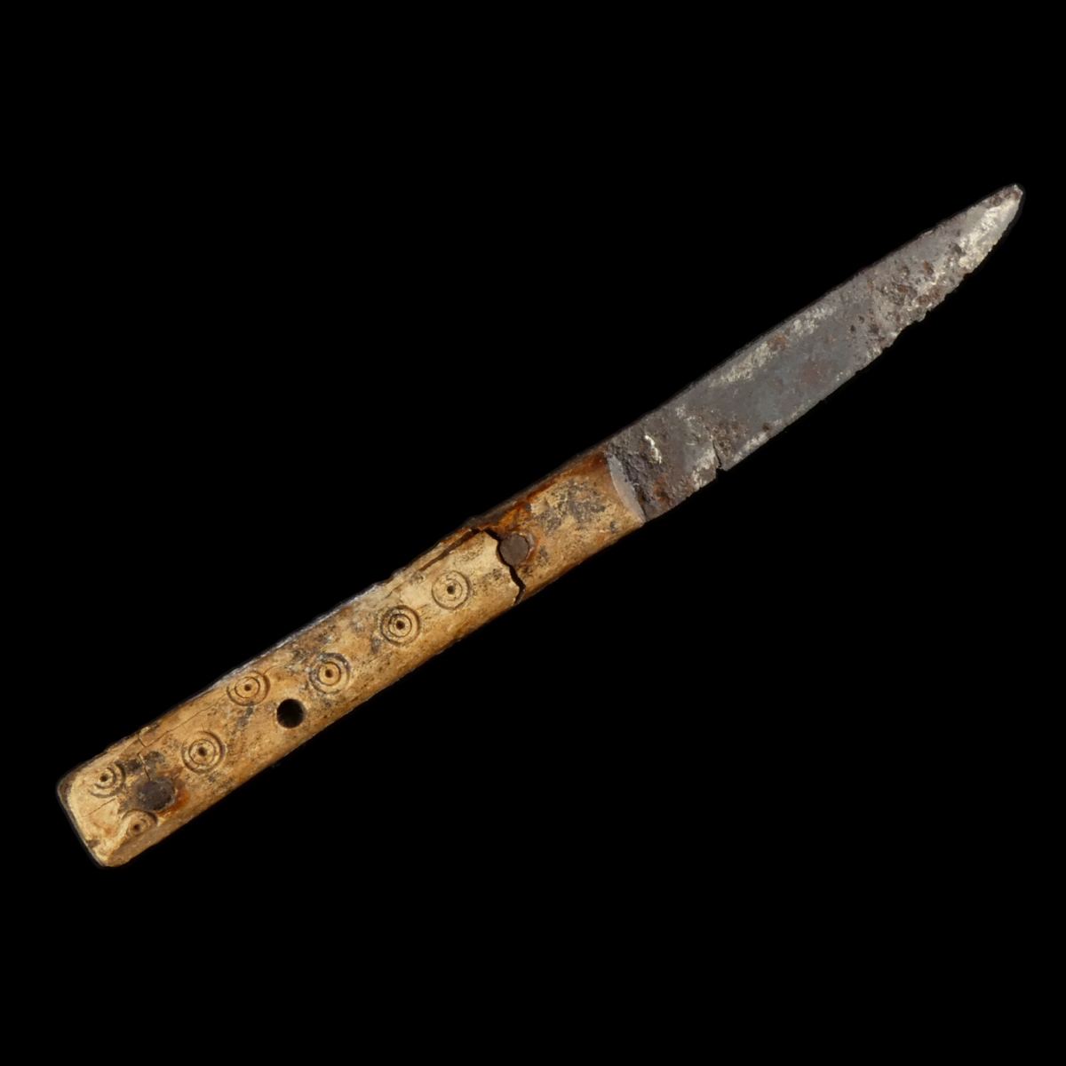 Early Medieval iron knife with decorated bone handle
