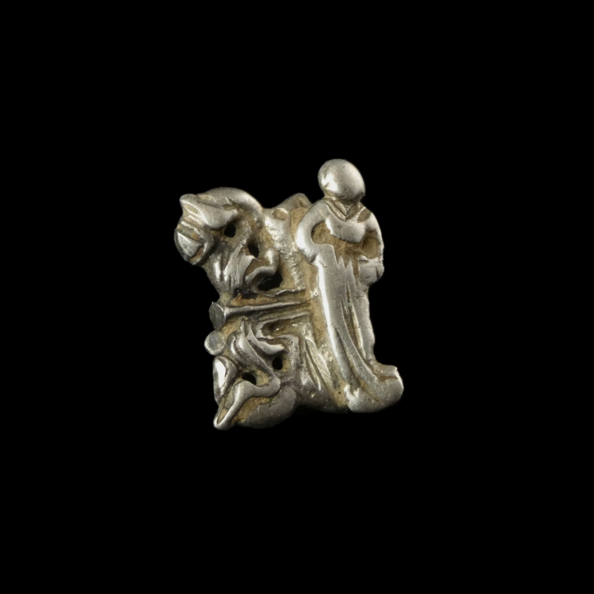 Late Medieval silver openwork dress hook with female figure and floral decoration