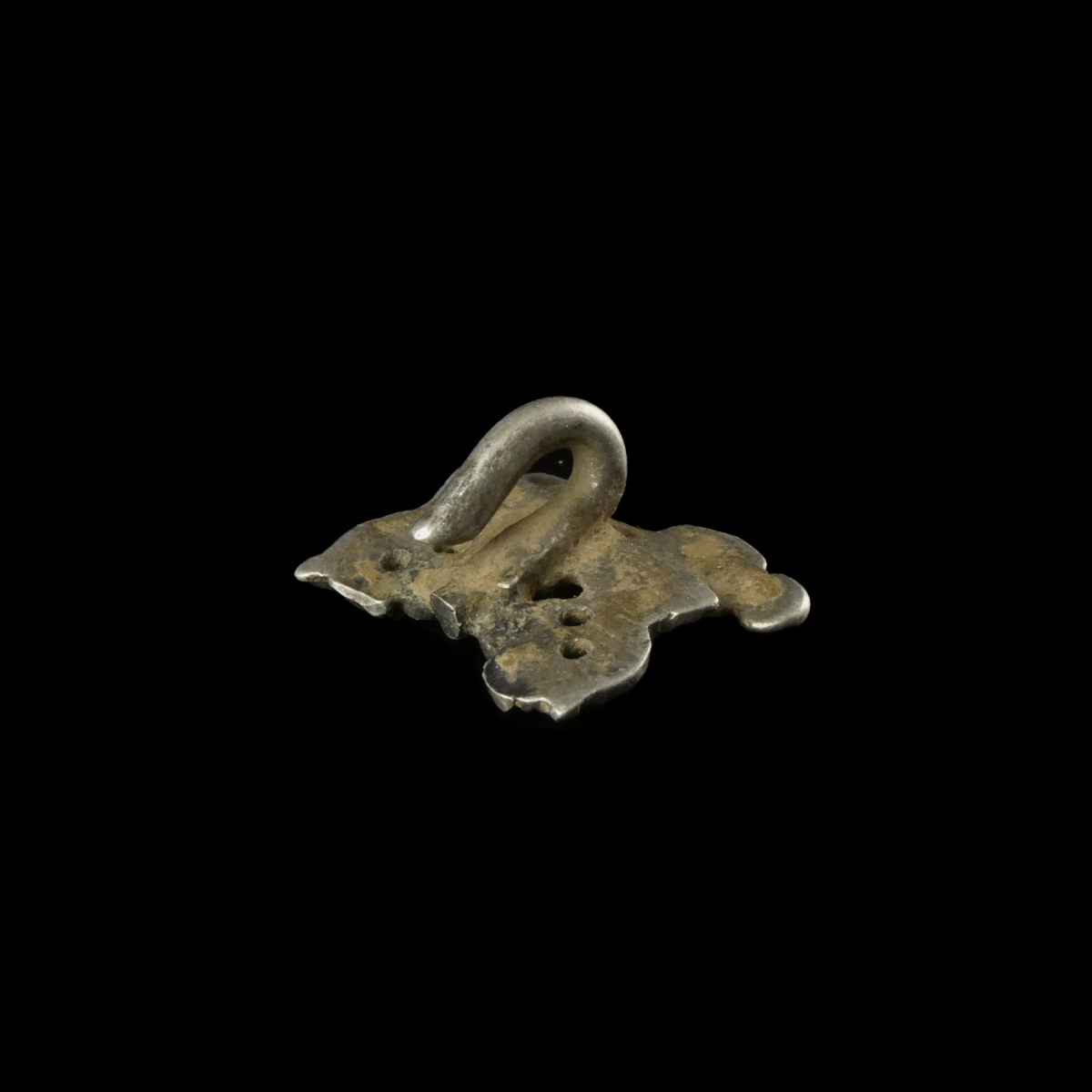 Late Medieval silver openwork dress hook with female figure and floral decoration