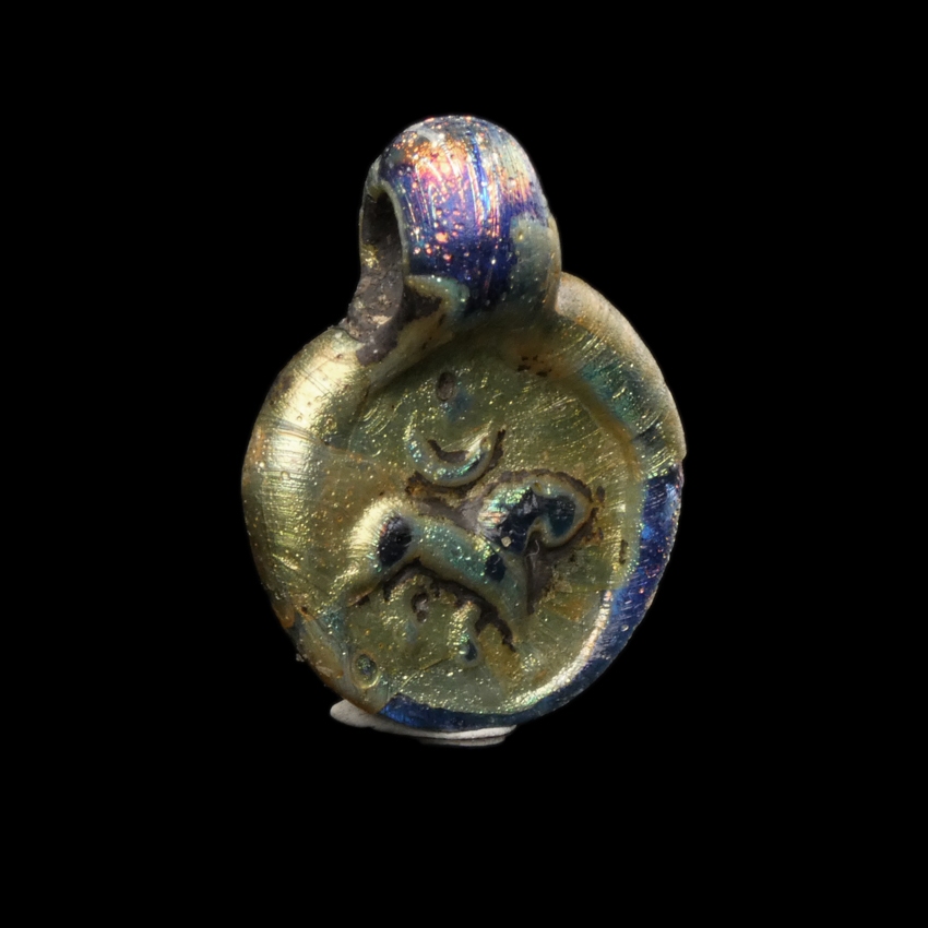 Late Roman Glass Amulet Pendant with Lion, Moon and Sun / Star