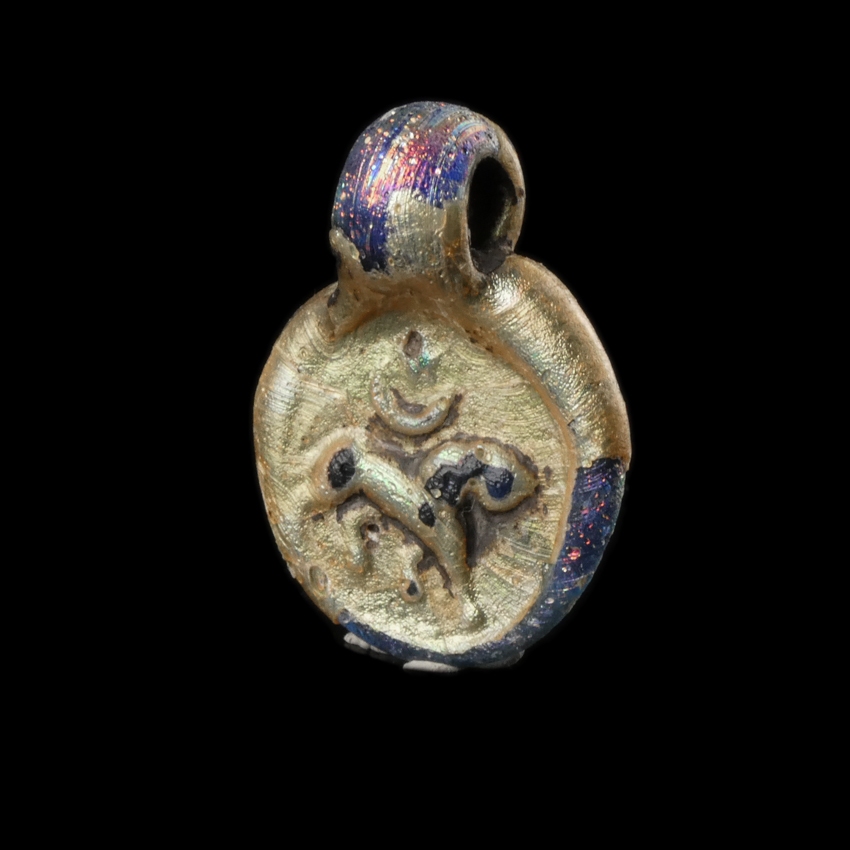 Late Roman Glass Amulet Pendant with Lion, Moon and Sun / Star