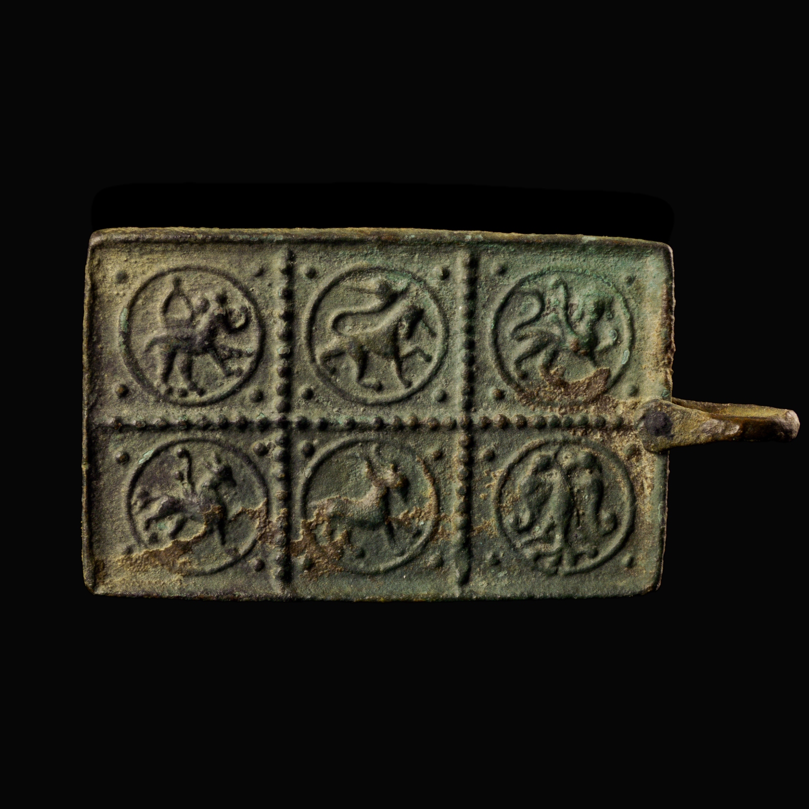 Medieval bronze harness pendant with a princely and protective bestiary