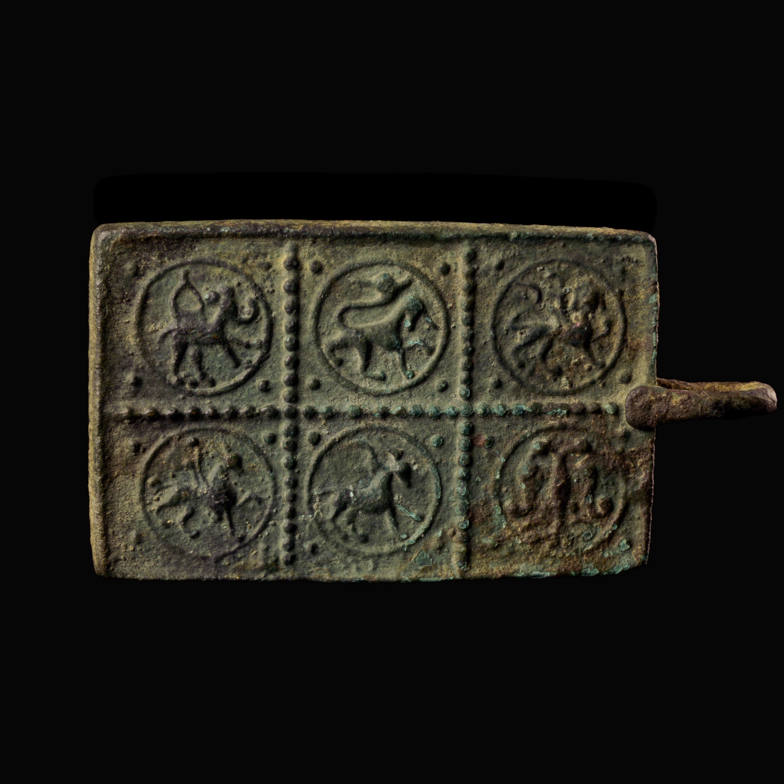 Medieval bronze harness pendant with a princely and protective bestiary